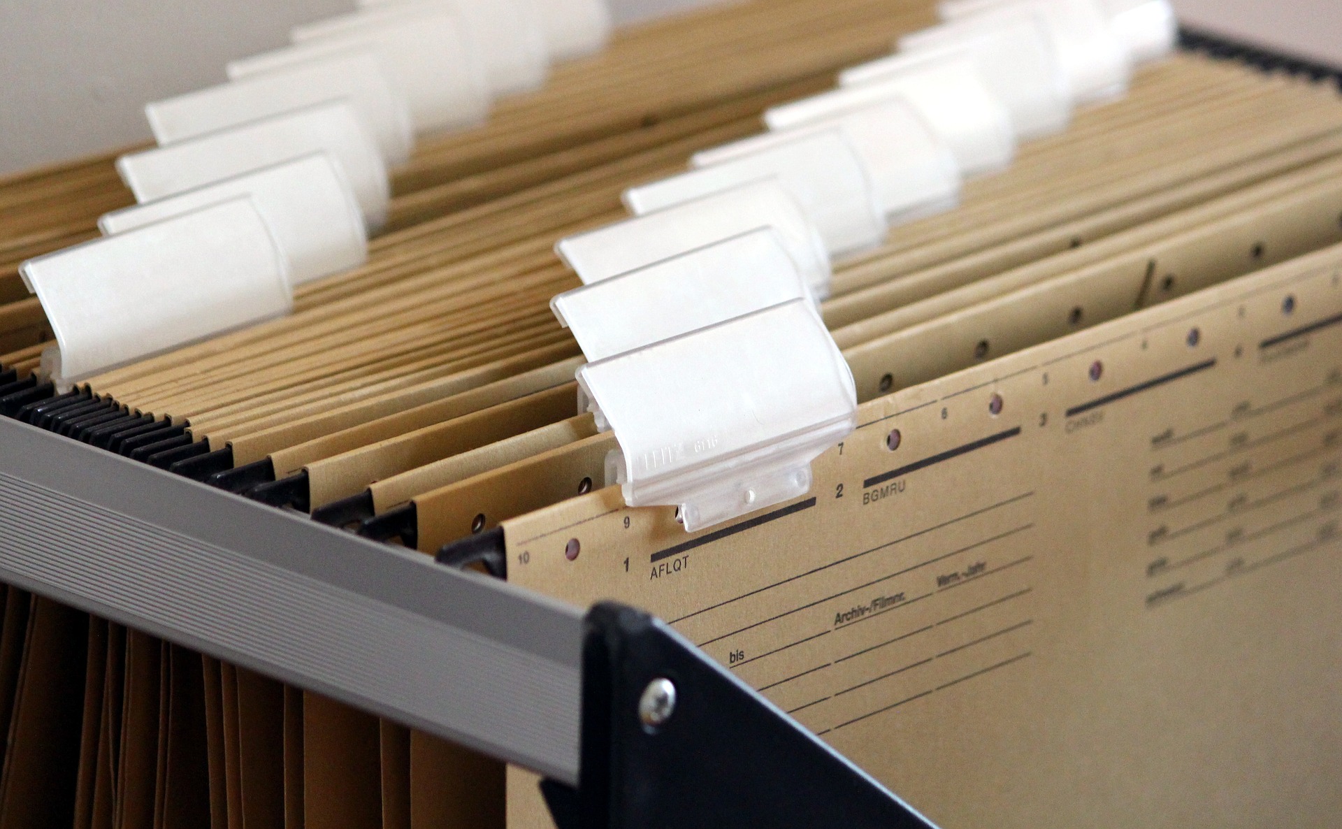 File drawer with brown hanging files and white tabs